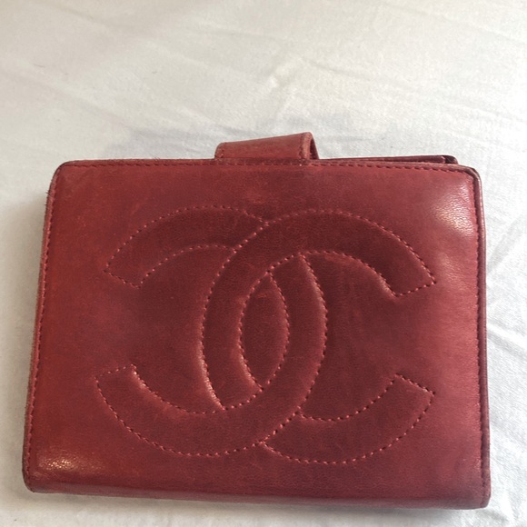 CHANEL Handbags - Chanel lambskin red compact wallet in well loved condition